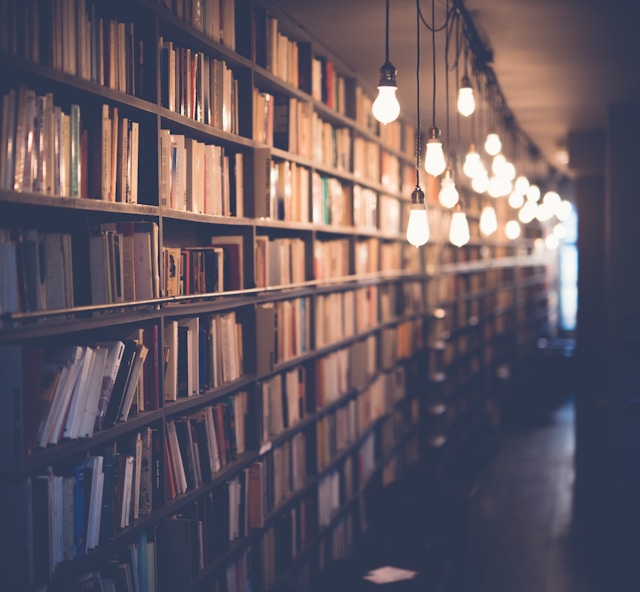Picture of an old library with lots of books on shelves.